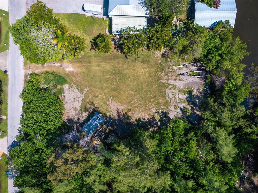 4210 128th Street West Cortez, FL 34215 - Photo 10 of 15 an aerial view of a residential houses with yard and green space