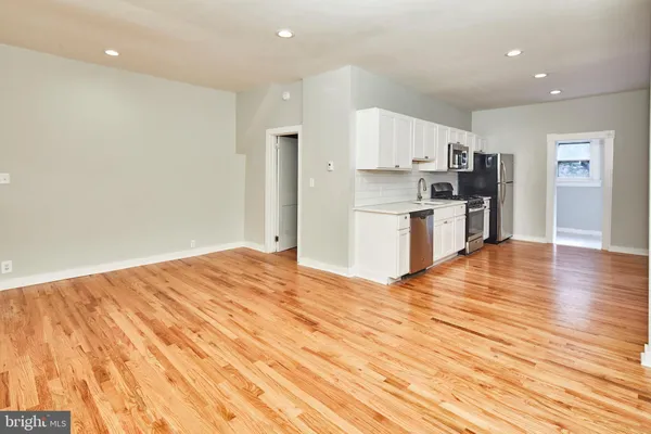 a view of kitchen and wooden floor