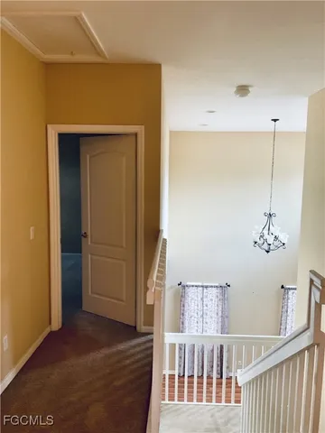 a view of a hallway view with staircase