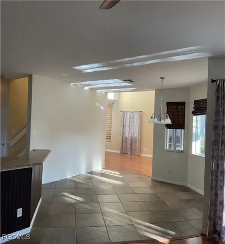 a view of a hallway with wooden shelves