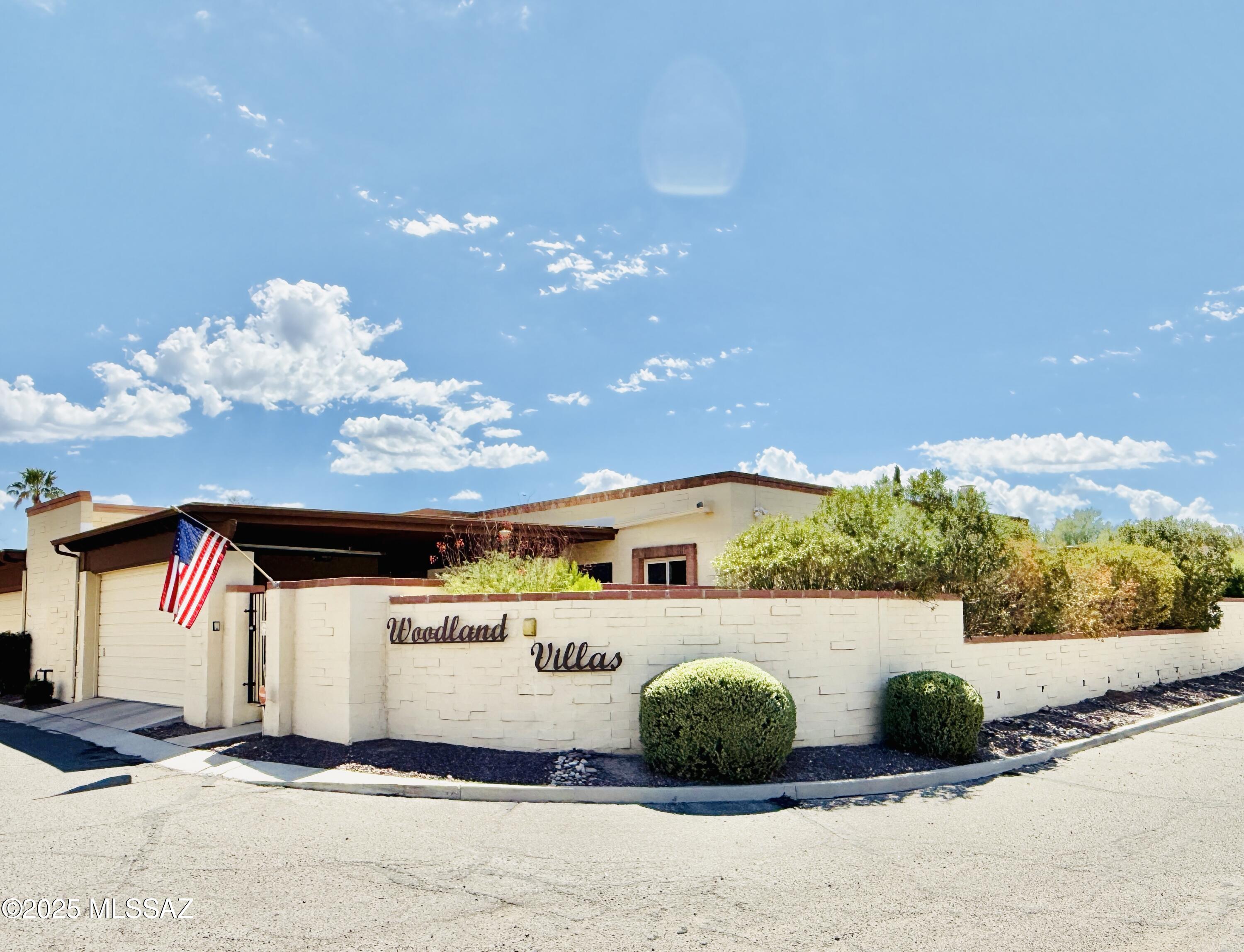 8110 East Rivenoak Circle Tucson, AZ 85715 - Photo 1 of 29 a front view of a multi story residential apartment building
