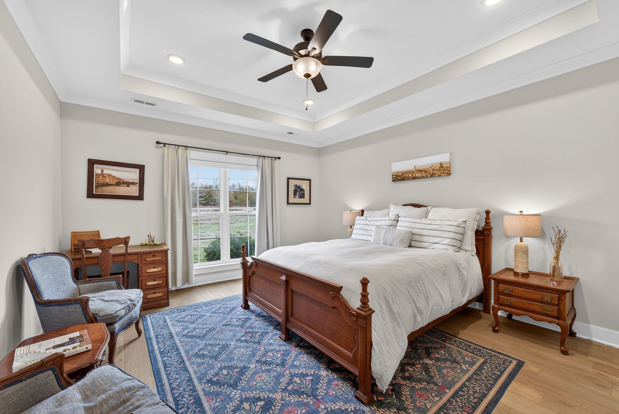 3834 Holly Grove Road Lascassas, TN 37085 - Photo 18 of 60 a bedroom with a bed a couch and a chandelier
