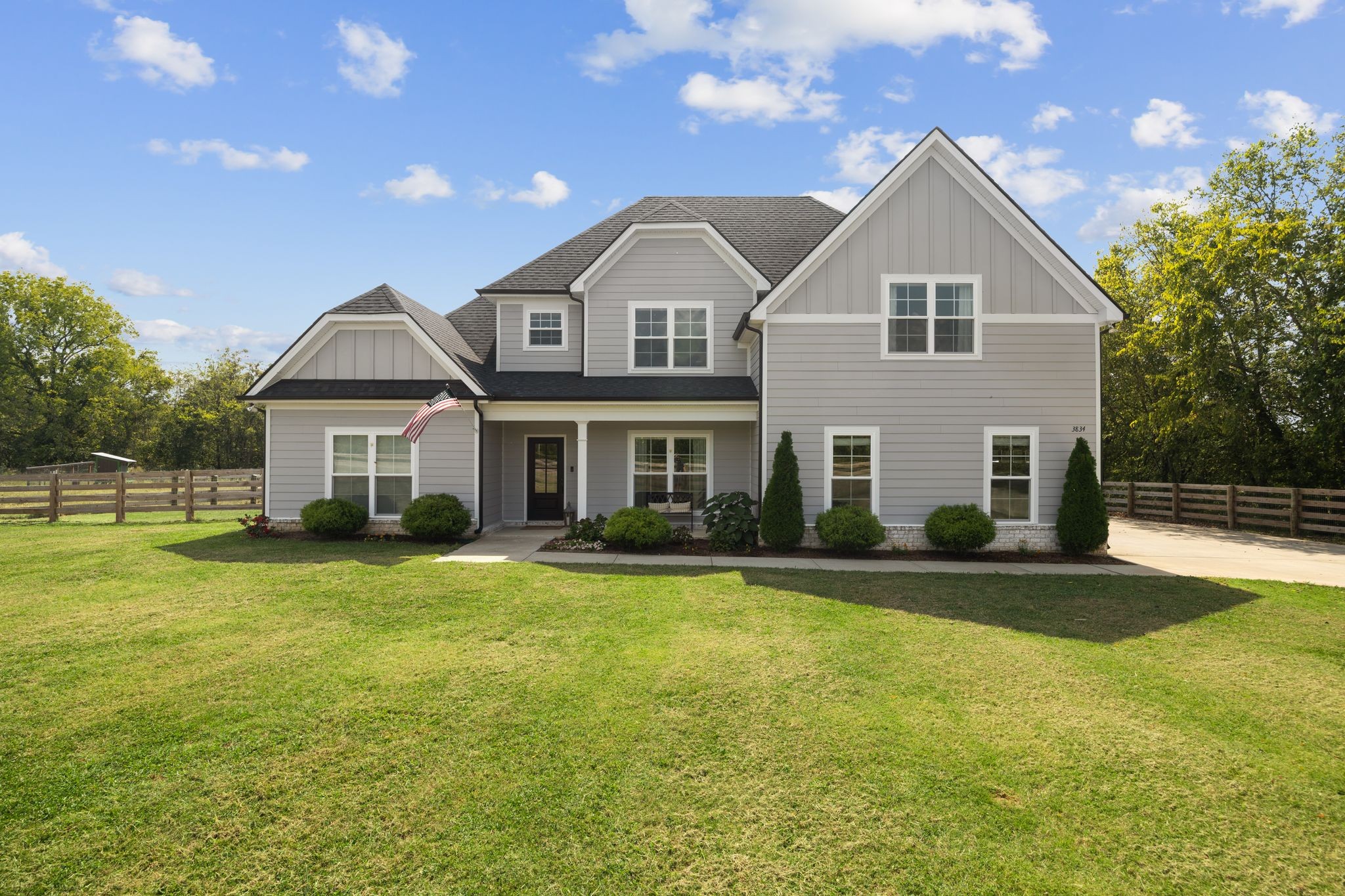 3834 Holly Grove Road Lascassas, TN 37085 - Photo 2 of 60 a front view of a house with a yard and garage