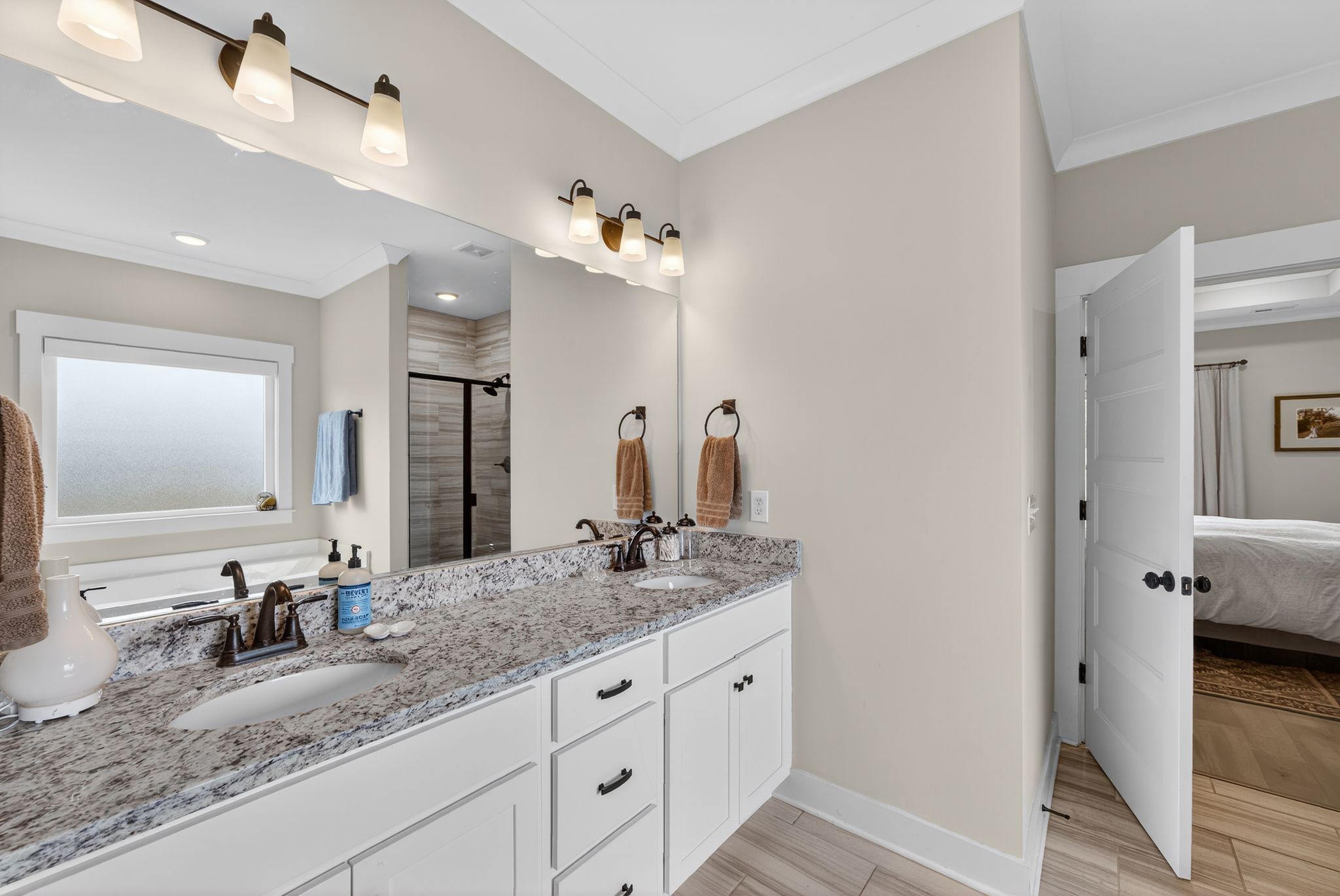 3834 Holly Grove Road Lascassas, TN 37085 - Photo 23 of 60 a bathroom with double vanity sinks a vanity and a mirror
