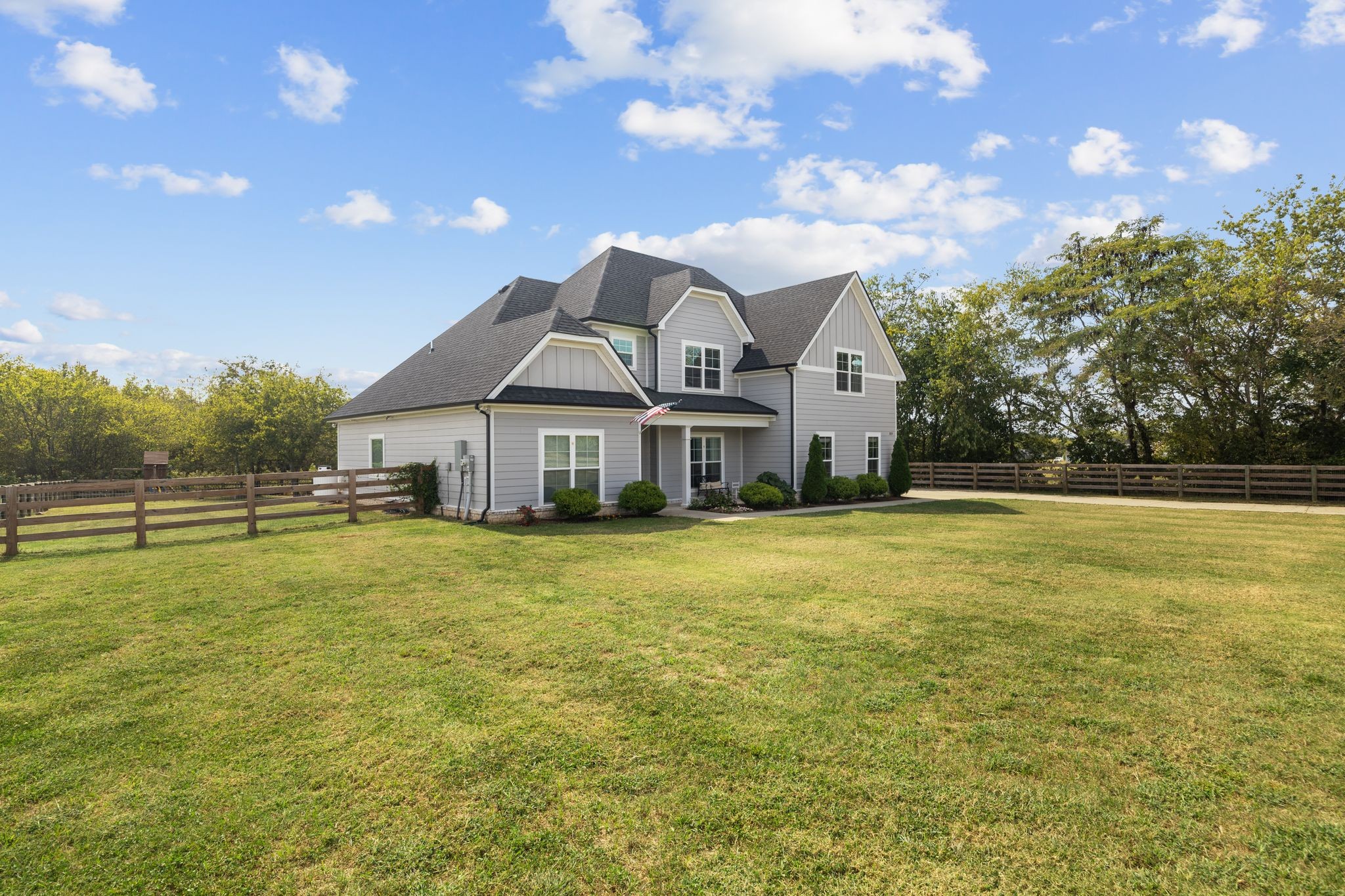 3834 Holly Grove Road Lascassas, TN 37085 - Photo 3 of 60 a front view of a house with a garden