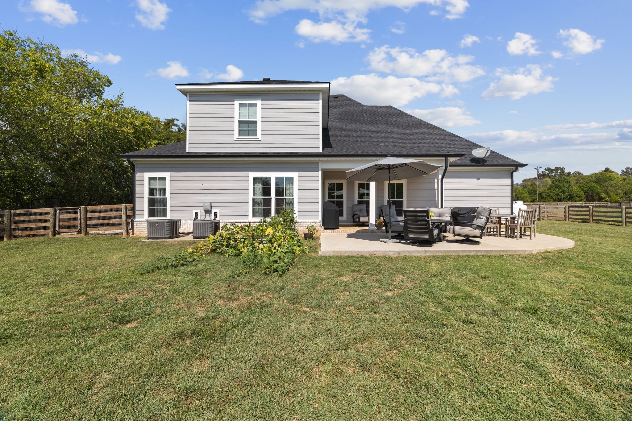3834 Holly Grove Road Lascassas, TN 37085 - Photo 44 of 60 a view of a house with a yard patio and fire pit
