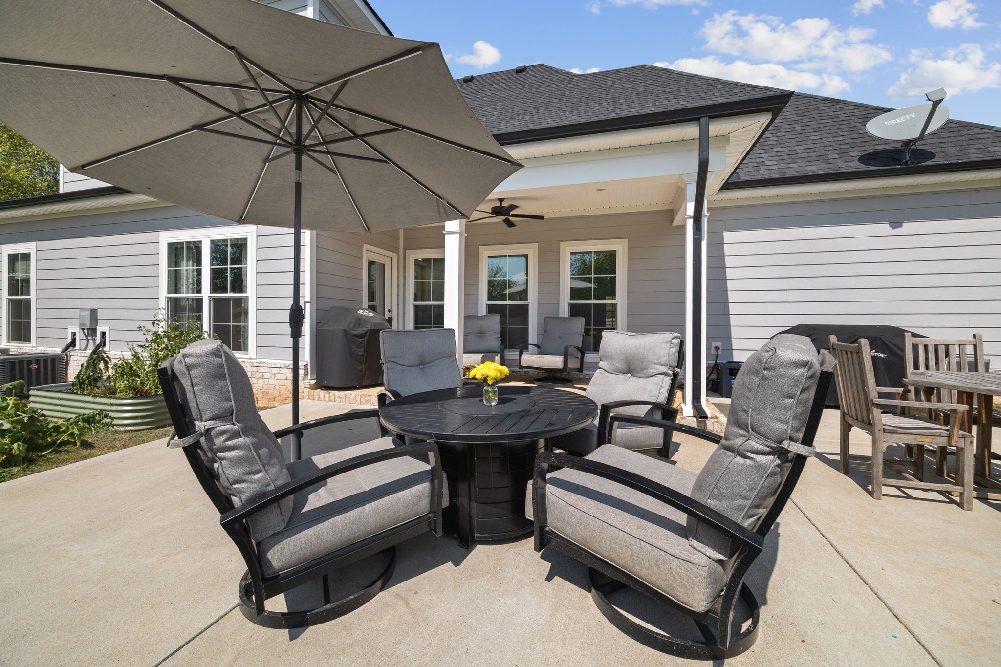 3834 Holly Grove Road Lascassas, TN 37085 - Photo 46 of 60 a view of a patio with a table and chairs