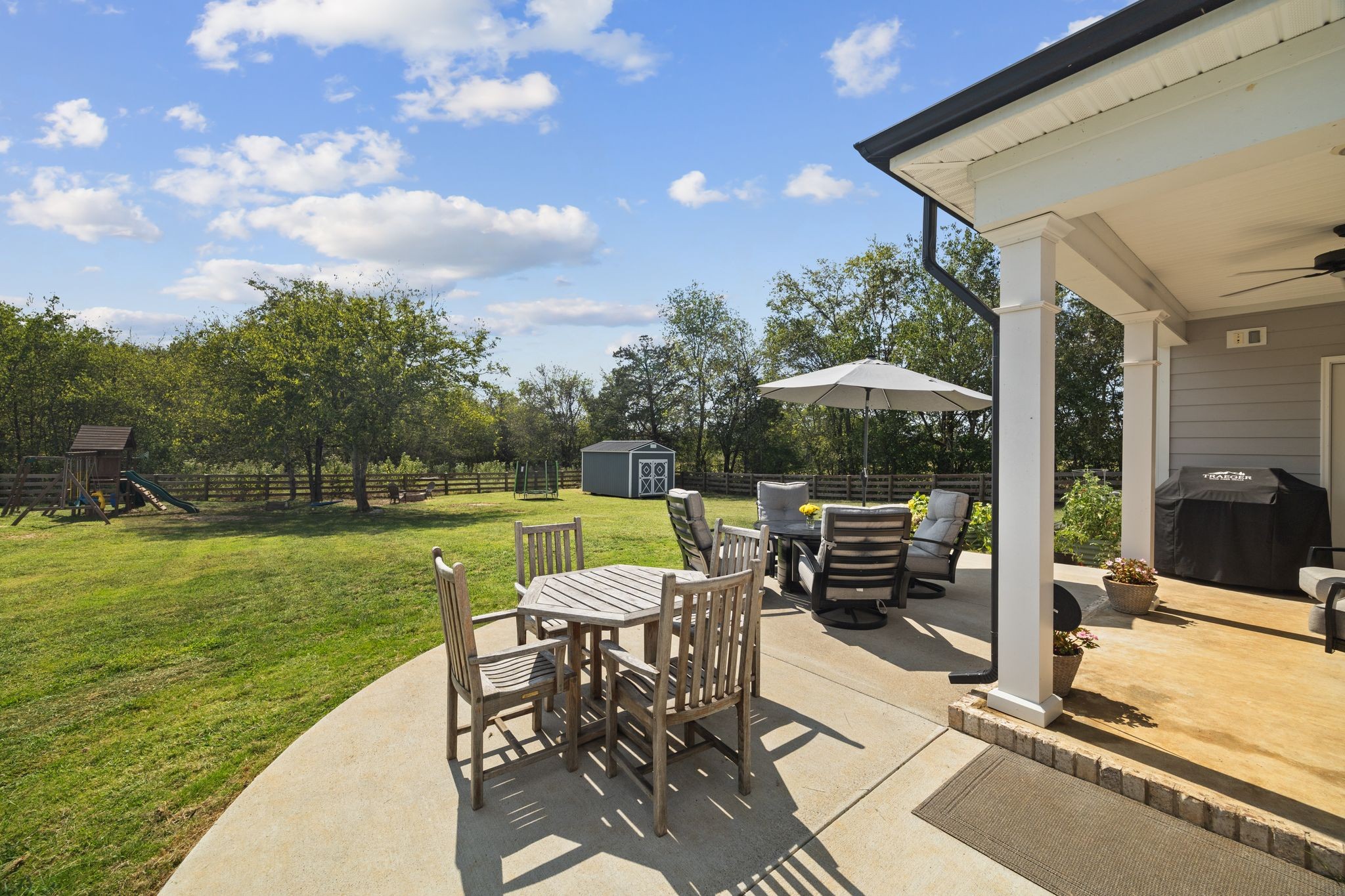 3834 Holly Grove Road Lascassas, TN 37085 - Photo 47 of 60 a view of a patio with a table chairs and a table