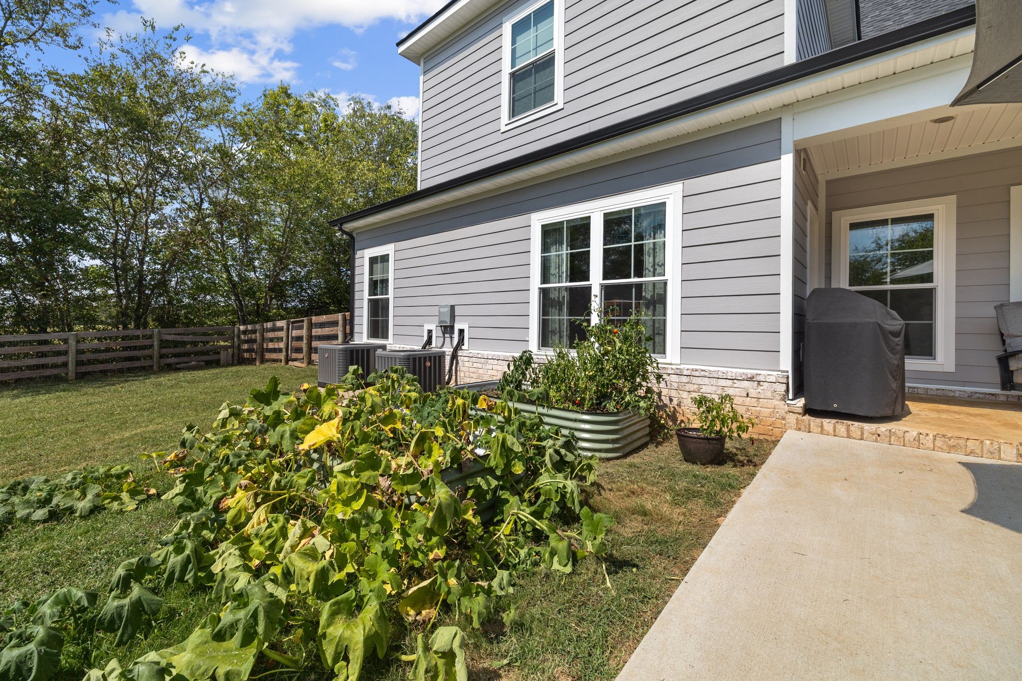 3834 Holly Grove Road Lascassas, TN 37085 - Photo 49 of 60 a front view of a house with garden