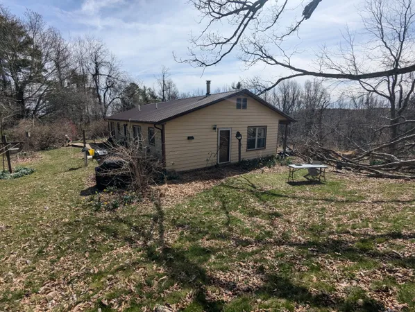 a view of a yard covered with snow in outdoor