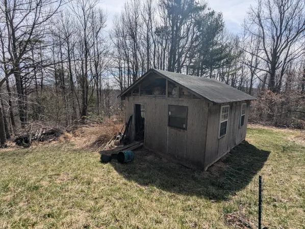 a house with trees in the background