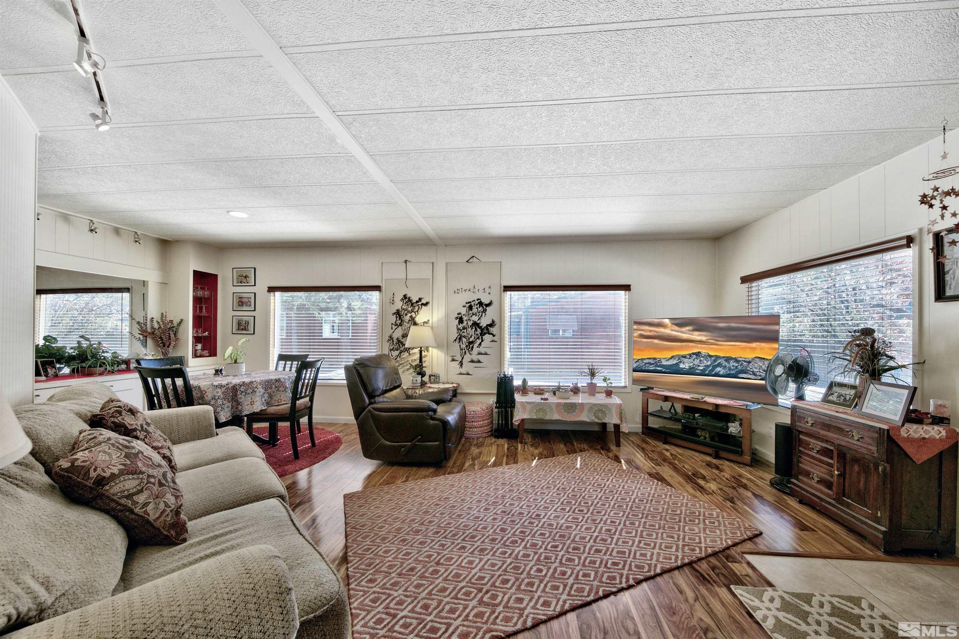 166 Crescent Drive Stateline, NV 89449 - Photo 6 of 19 a living room with furniture and a flat screen tv