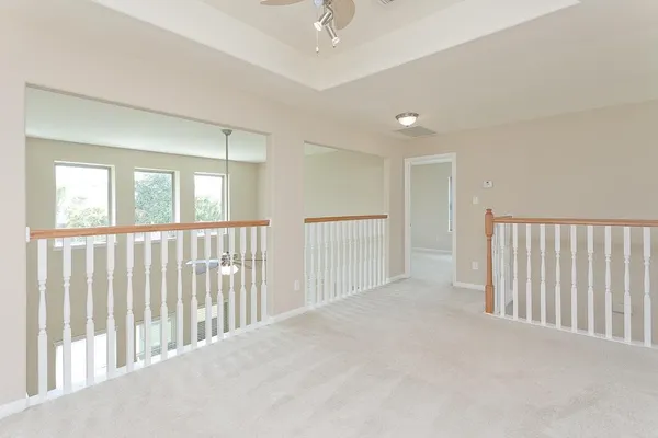a view of a hallway with windows