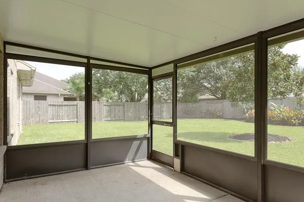 a view of an empty room with a large window