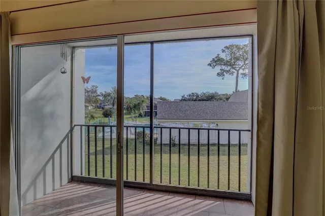 a kitchen with granite countertop a stove a sink and a refrigerator
