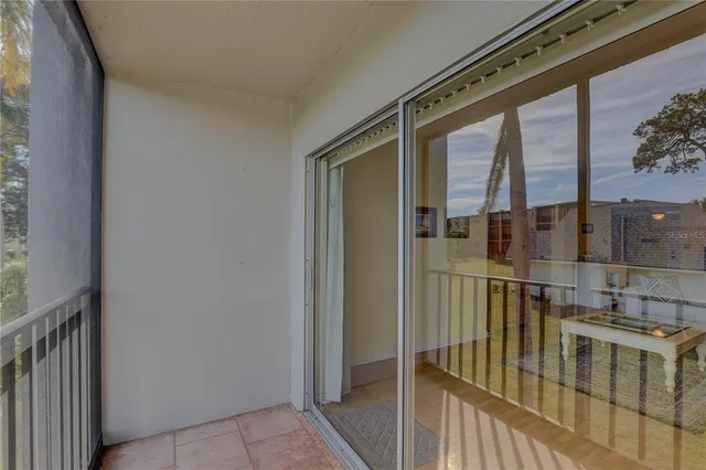 a kitchen with white cabinets and sink