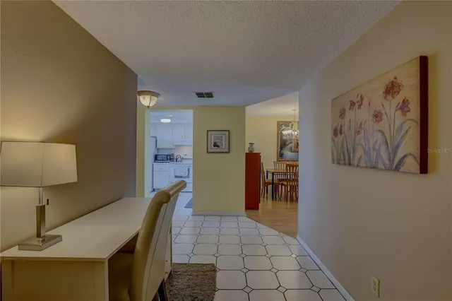 a view of a dining room with furniture wooden floor and chandelier
