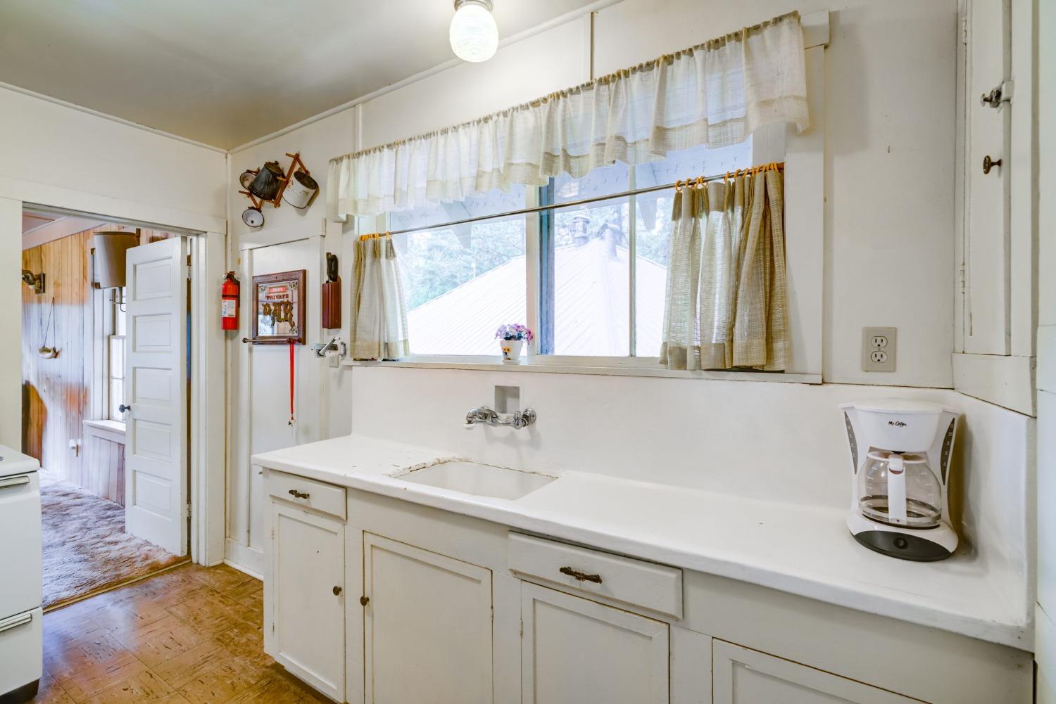 50062 Poplar Road Oakhurst, CA 93644 - Photo 16 of 38 a bathroom with a sink a mirror and a shower