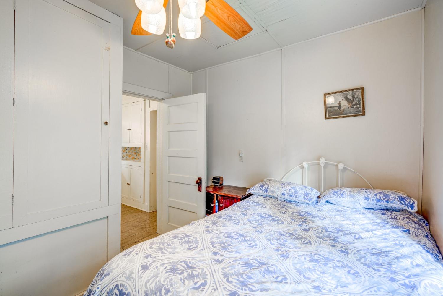 50062 Poplar Road Oakhurst, CA 93644 - Photo 23 of 38 a bedroom with a bed and a dresser