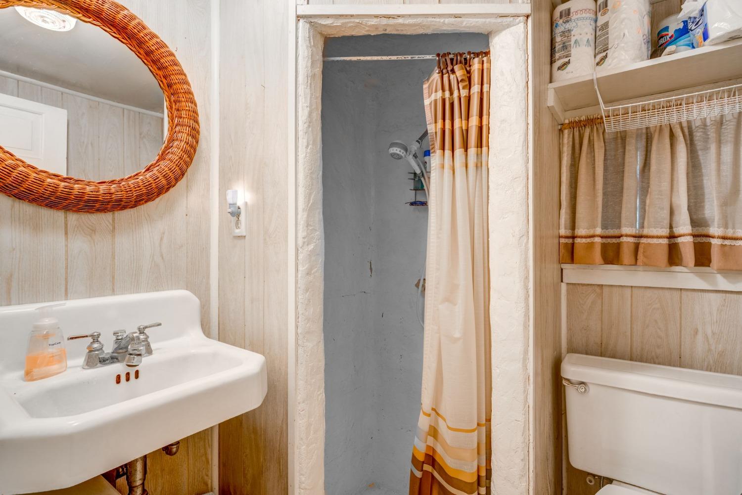 50062 Poplar Road Oakhurst, CA 93644 - Photo 26 of 38 a bathroom with a sink and mirror