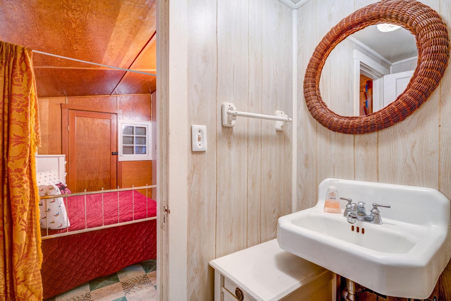 50062 Poplar Road Oakhurst, CA 93644 - Photo 27 of 38 a bathroom with a sink and a mirror