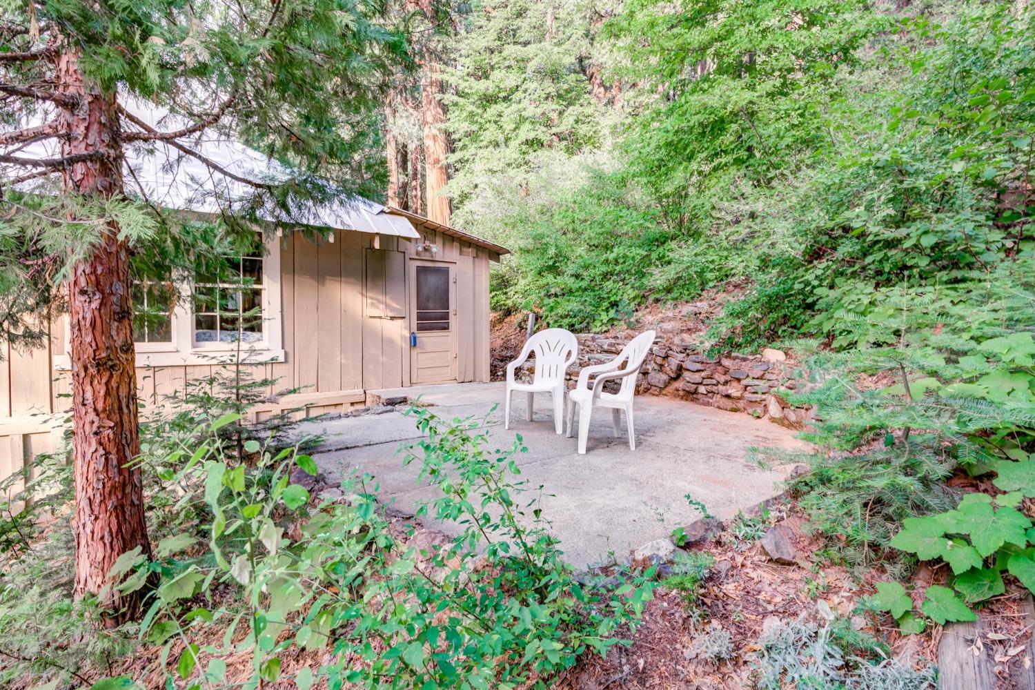 50062 Poplar Road Oakhurst, CA 93644 - Photo 30 of 38 a view of a chair and table in the garden