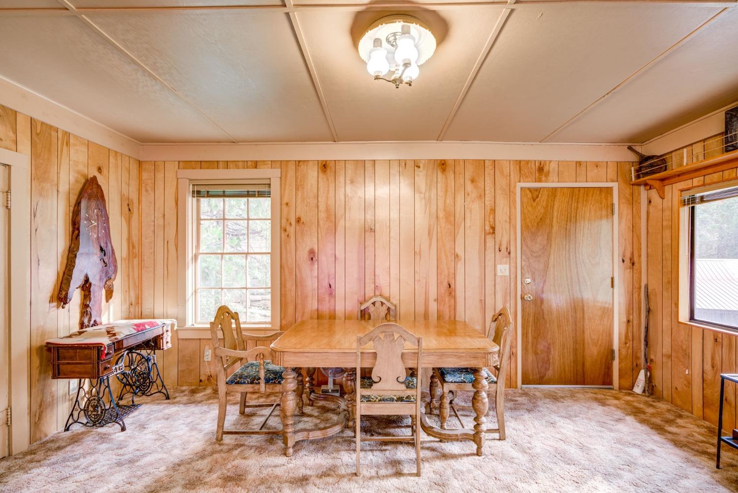 50062 Poplar Road Oakhurst, CA 93644 - Photo 9 of 38 a view of a livingroom with furniture window and wooden floor