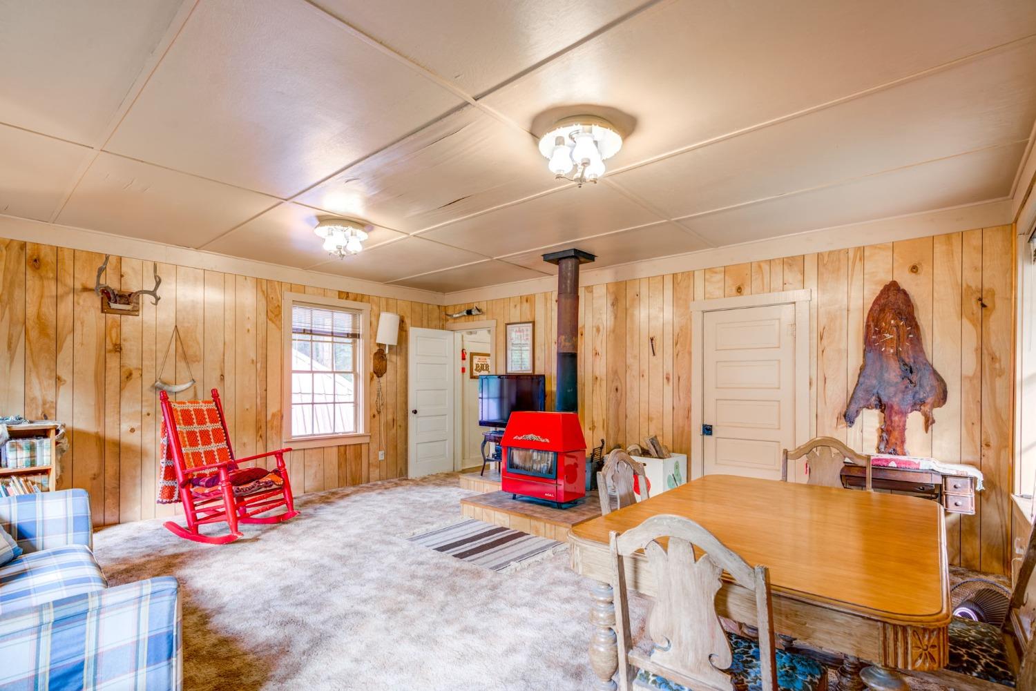 50062 Poplar Road Oakhurst, CA 93644 - Photo 10 of 38 a bedroom with furniture and a large window