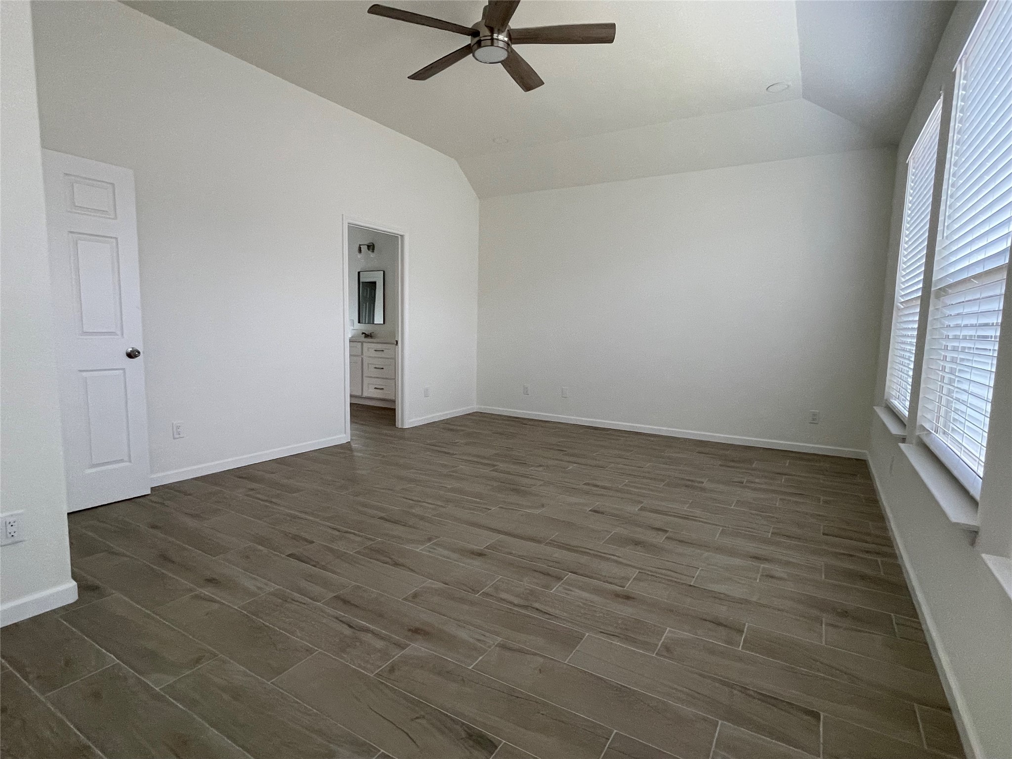 4118 Guild Meadows Drive Houston, TX 77084 - Photo 25 of 35 wooden floor in an empty room with a window