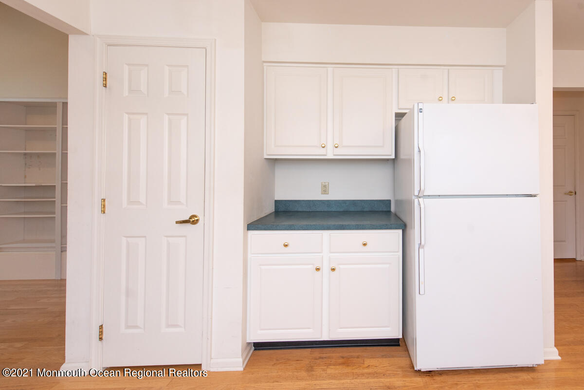5 Dexter Lane Jackson, NJ 08527 - Photo 15 of 55 a kitchen with a refrigerator and white cabinets