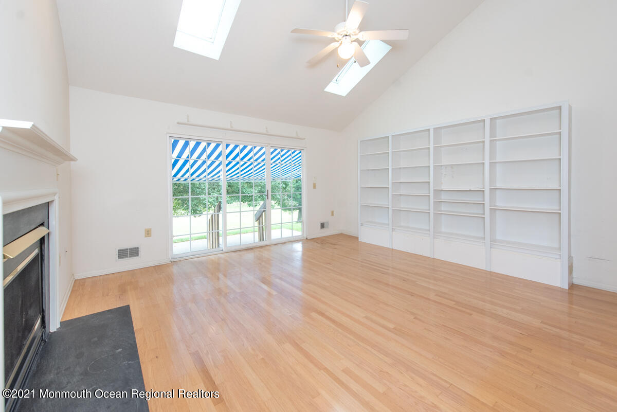 5 Dexter Lane Jackson, NJ 08527 - Photo 18 of 55 an empty room with wooden floor cabinet and windows
