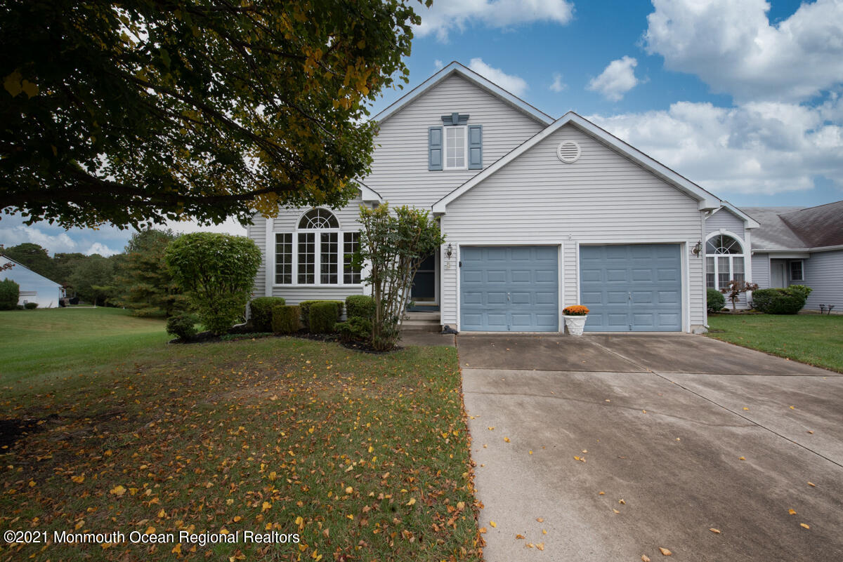 5 Dexter Lane Jackson, NJ 08527 - Photo 3 of 55 a front view of a house with a yard and garage