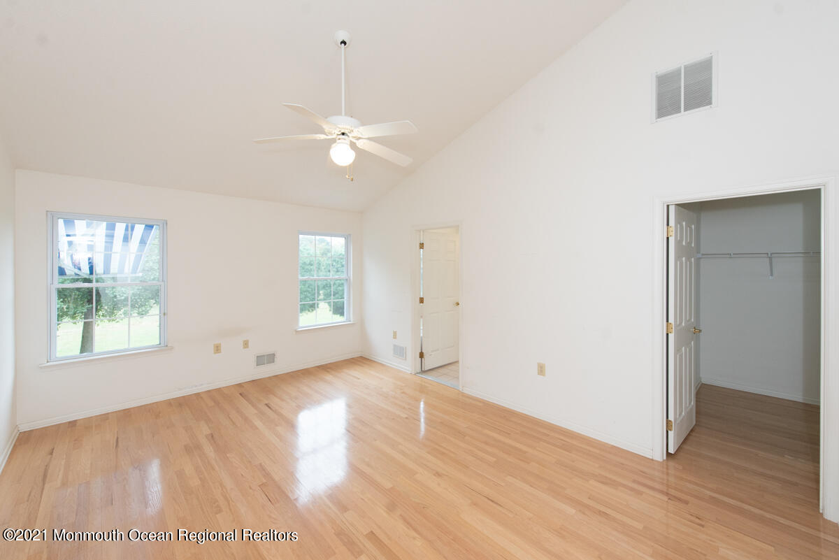 5 Dexter Lane Jackson, NJ 08527 - Photo 22 of 55 a view of empty room with wooden floor and fan