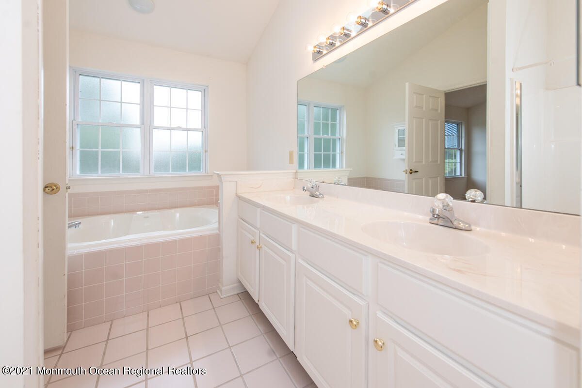 5 Dexter Lane Jackson, NJ 08527 - Photo 24 of 55 a bathroom with a bathtub sink and mirror