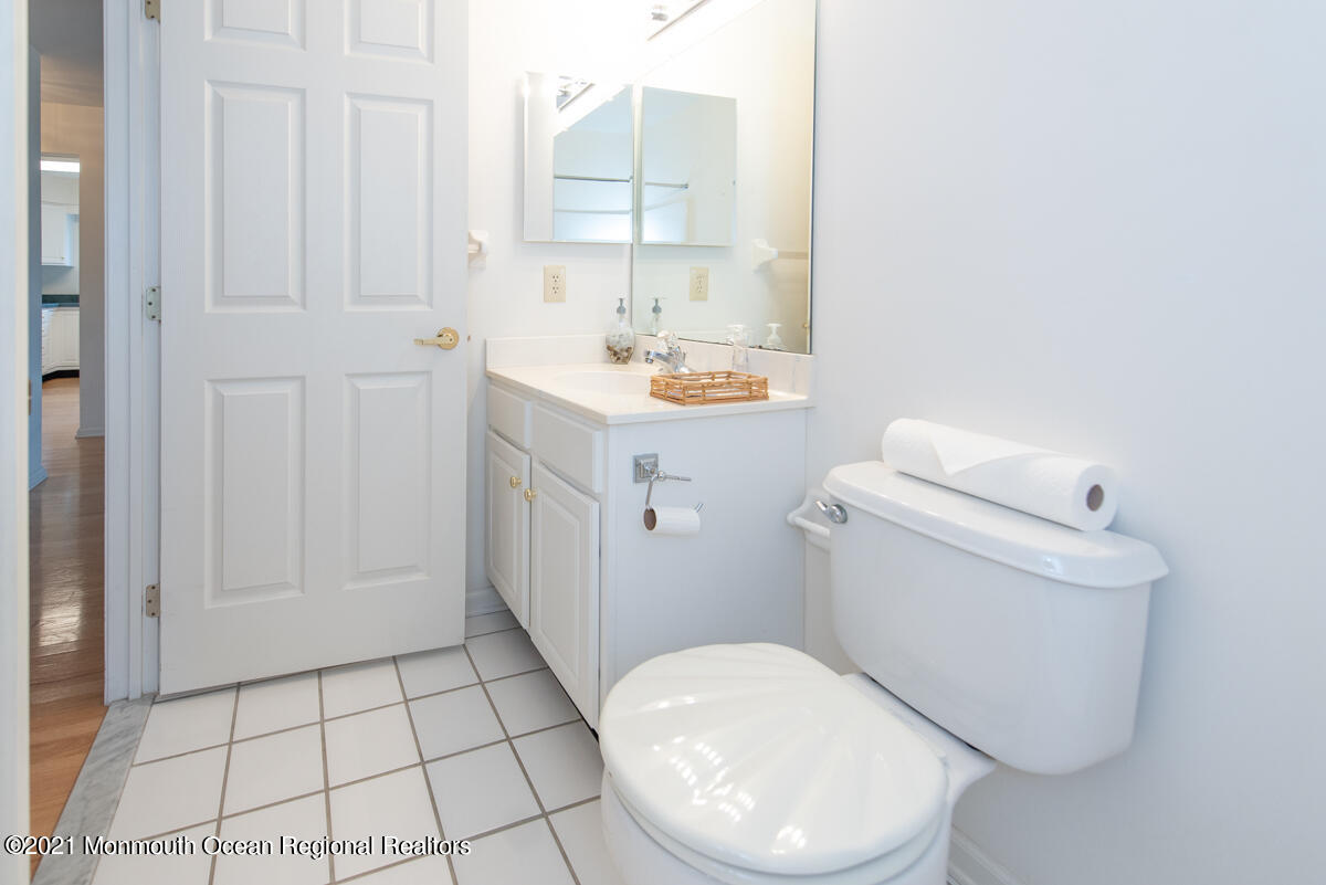 5 Dexter Lane Jackson, NJ 08527 - Photo 32 of 55 a bathroom with a sink a toilet and vanity