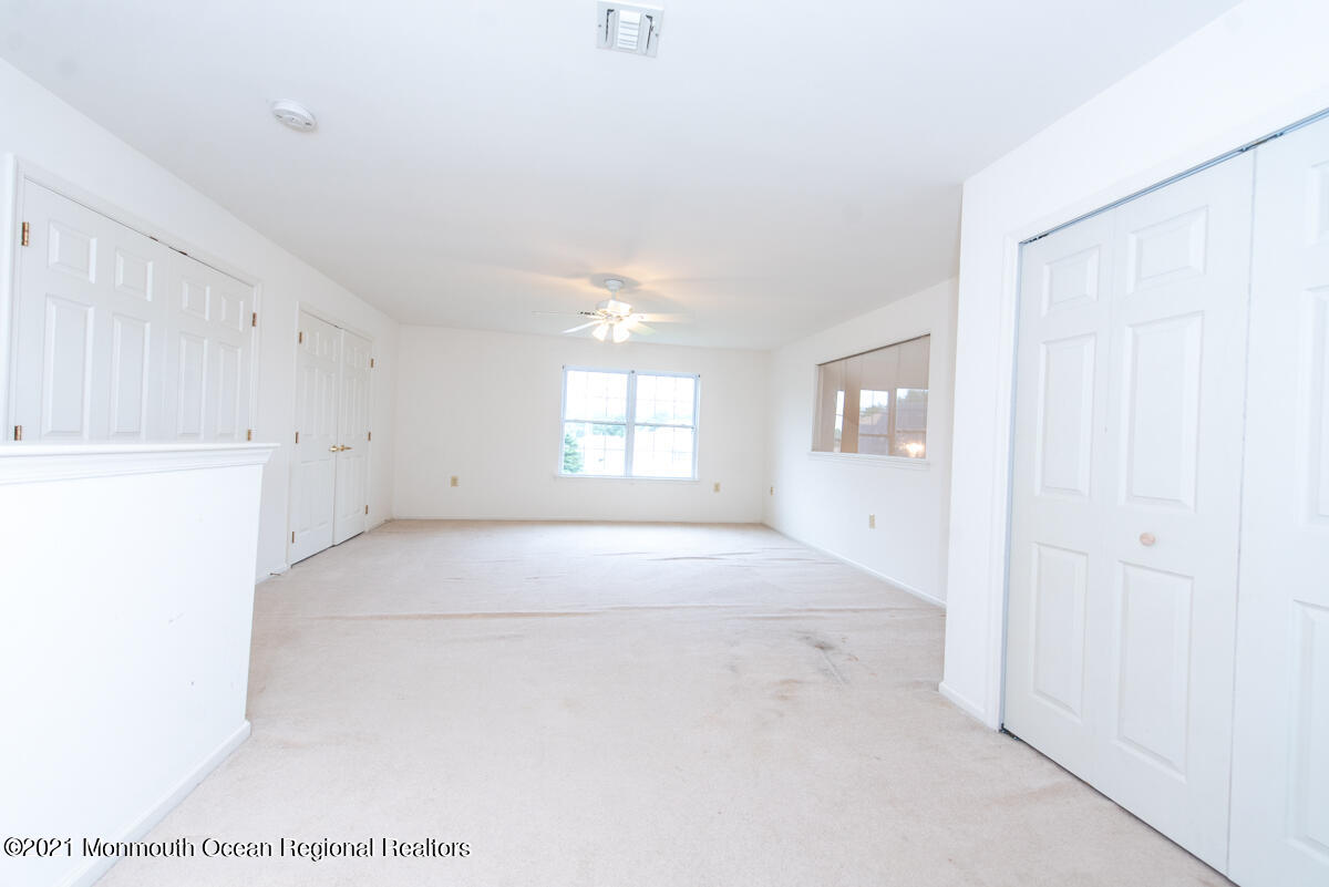 5 Dexter Lane Jackson, NJ 08527 - Photo 36 of 55 a view of an empty room with a window