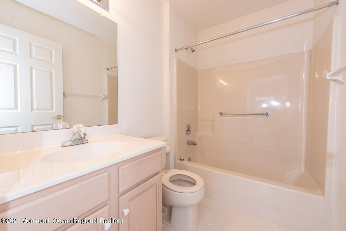 5 Dexter Lane Jackson, NJ 08527 - Photo 38 of 55 a bathroom with a sink a toilet and shower