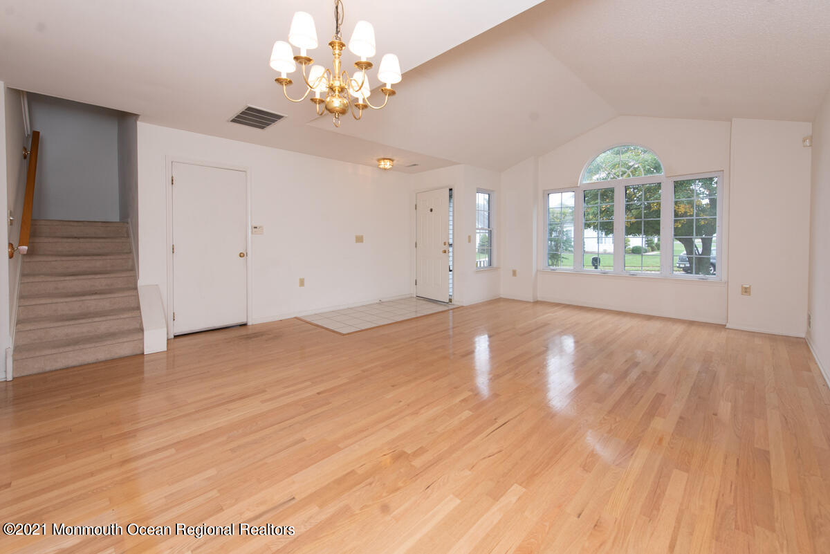 5 Dexter Lane Jackson, NJ 08527 - Photo 7 of 55 wooden floor in an empty room with a window