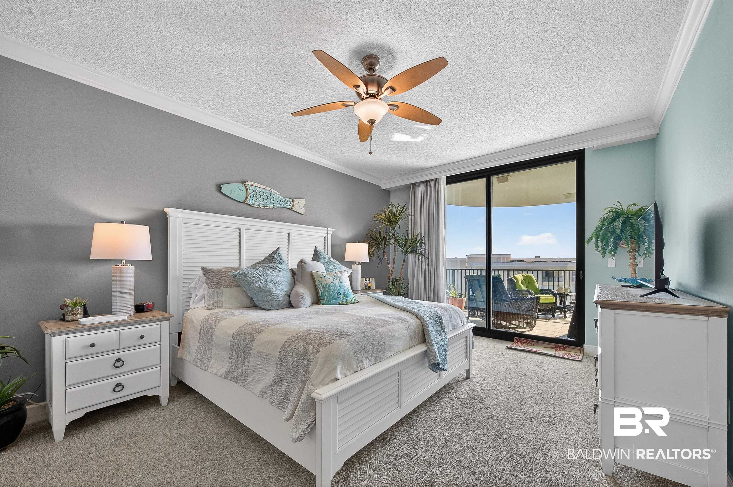 27582 Canal Road, Unit 2507 Orange Beach, AL 36561 - Photo 4 of 75 Bedroom featuring ornamental molding, access to outside, a textured ceiling, carpet, and a ceiling fan