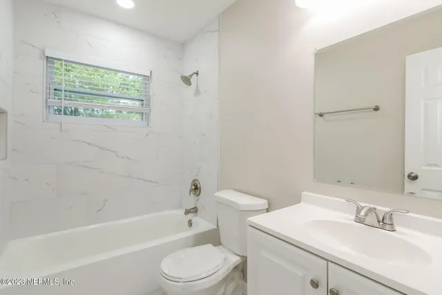 a bathroom with a sink toilet and bathtub
