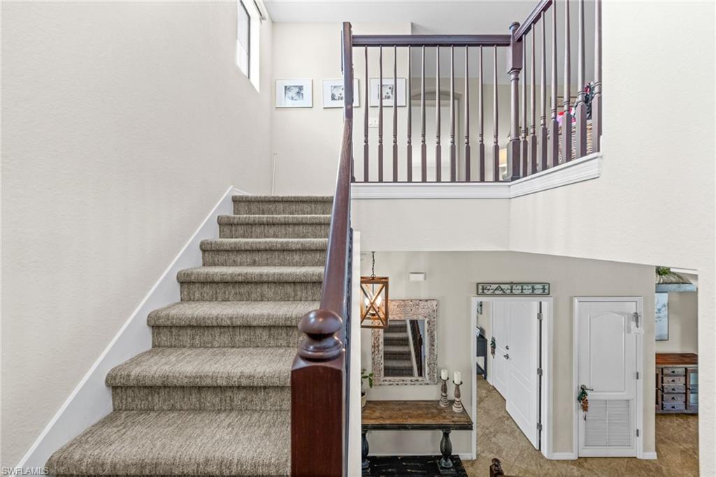 4754 Abaca Circle Naples, FL 34119 - Photo 3 of 46 a view of entryway with stairs and furniture