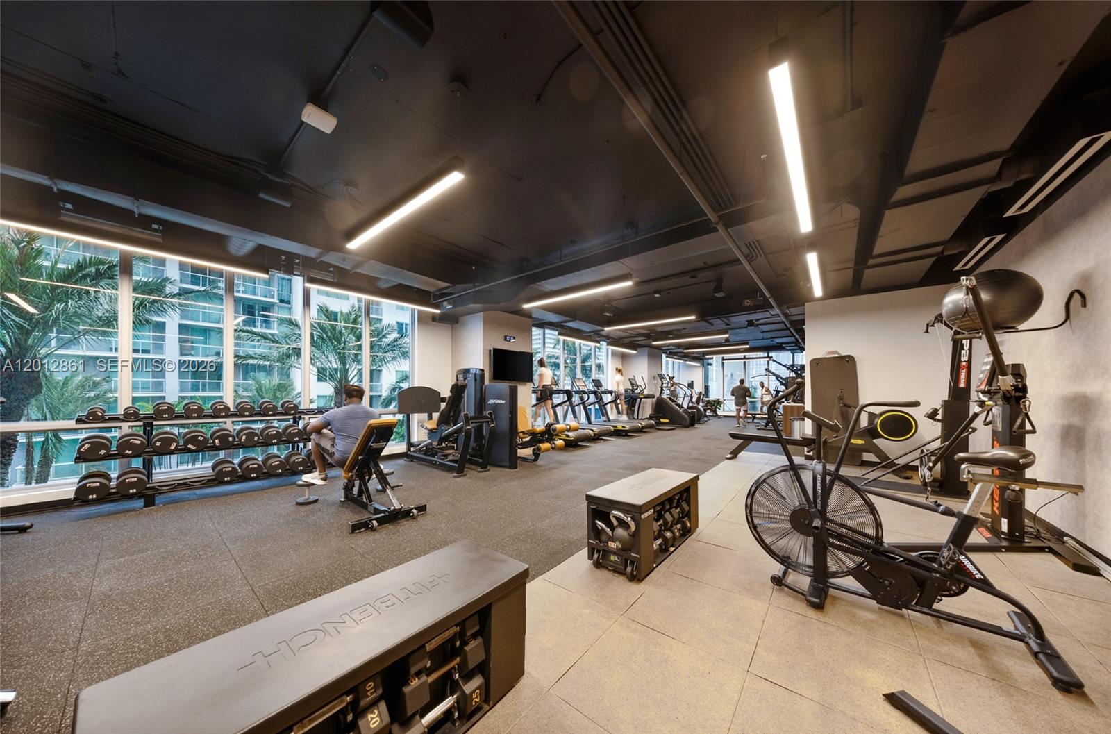 227 Northeast 2nd Street, Unit 1909 Miami, FL 33132 - Photo 18 of 18 a view of a room with gym equipment