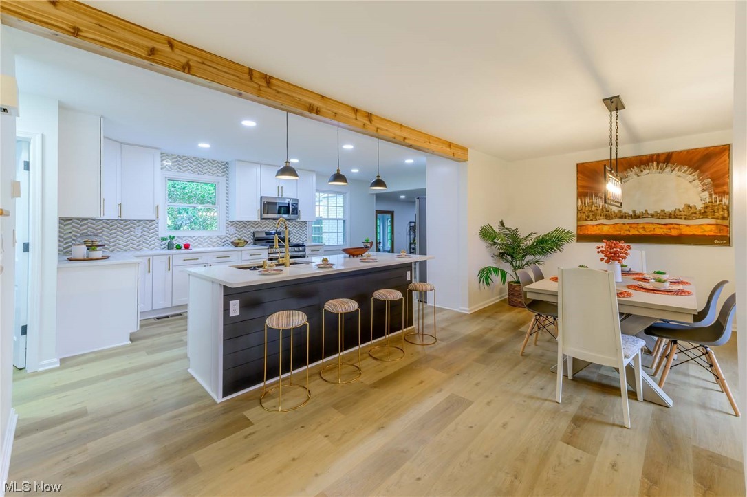 1820 Spring Valley Avenue Northwest Canton, OH 44708 - Photo 5 of 32 View of hardwood floored dining space