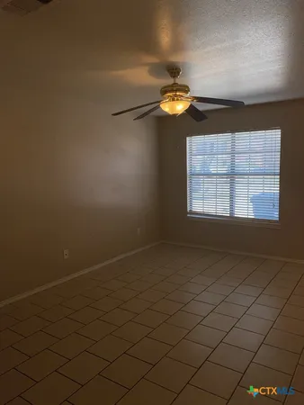 an empty room with a empty space and a window