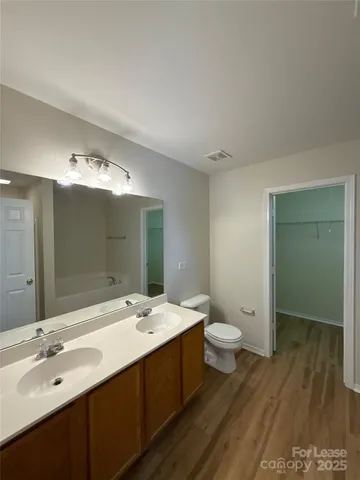 a bathroom with a bathtub and shower