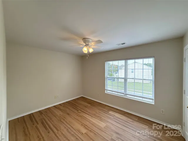 a white toilet sitting next to a bath tub