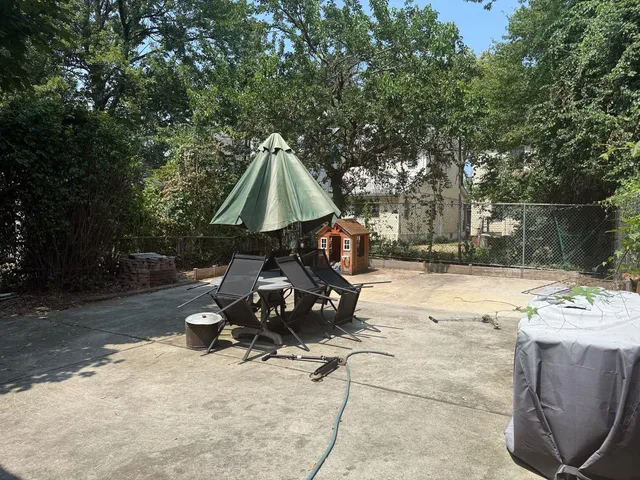 a view of backyard with slide and a slide