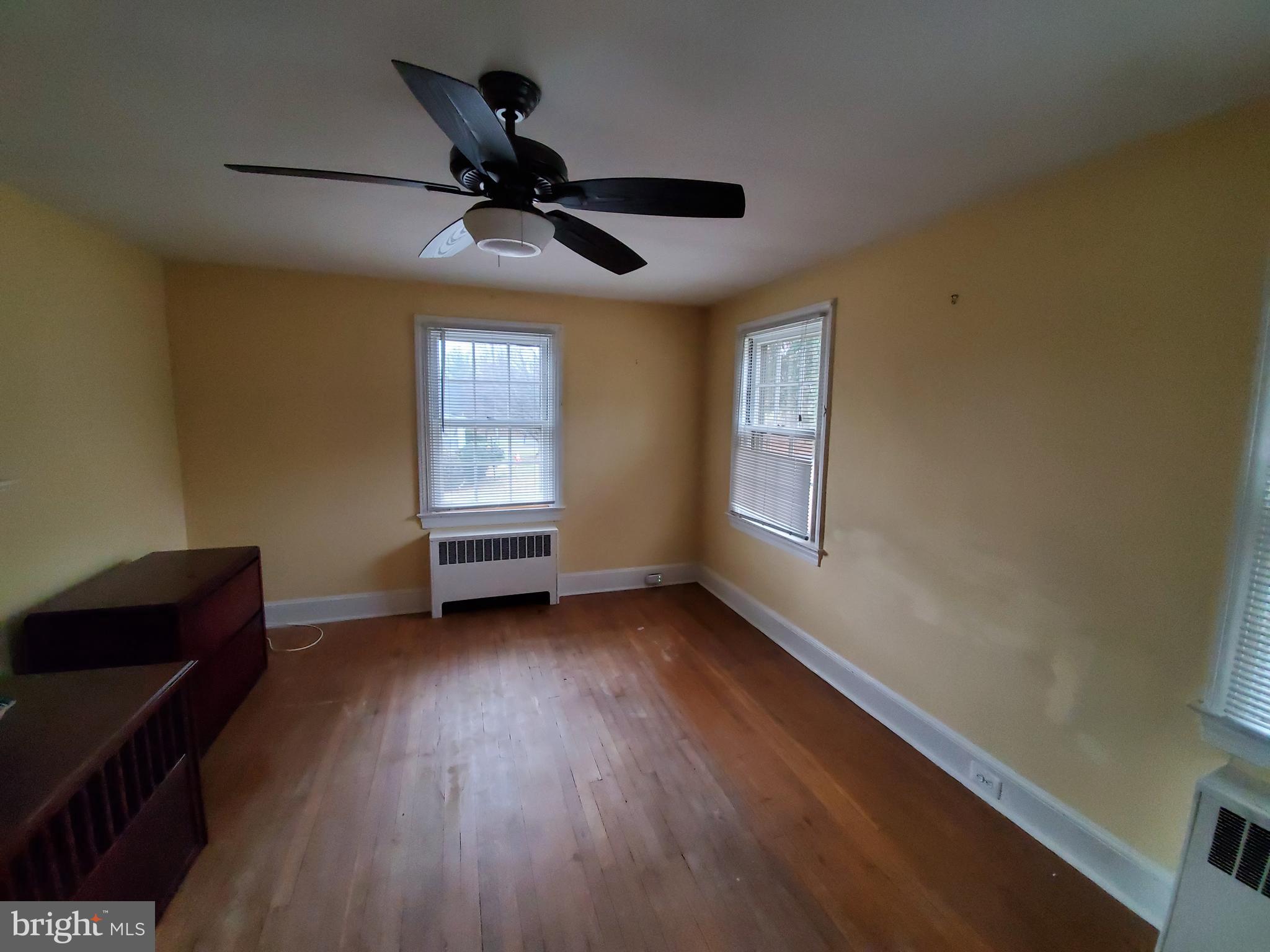 527 Old Meetze Road Warrenton, VA 20186 - Photo 5 of 10 a view of an empty room with a window and wooden floor