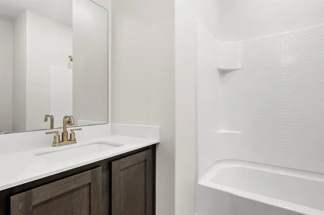 a bathroom with a sink and a bathtub