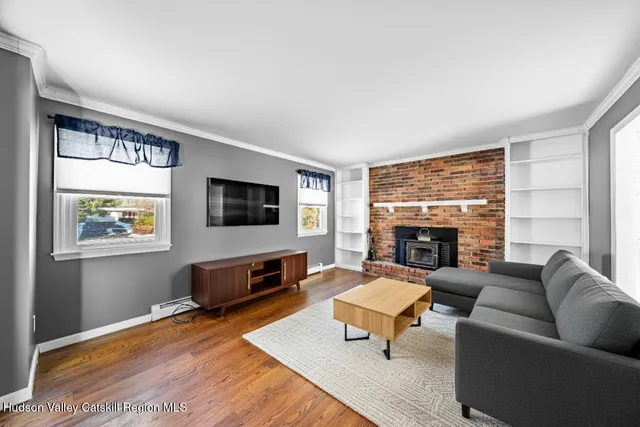 a kitchen with a stove a refrigerator and a sink